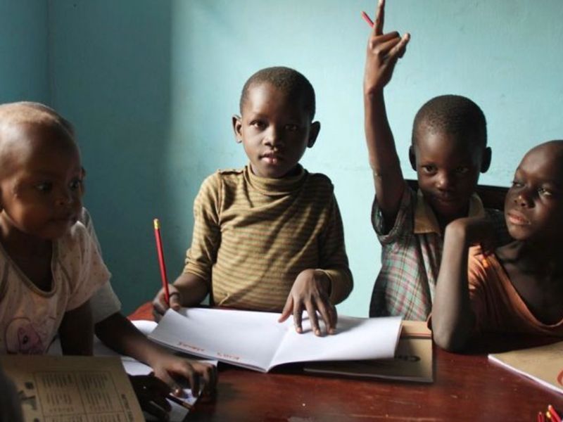 Scholarship - students seated at a desk